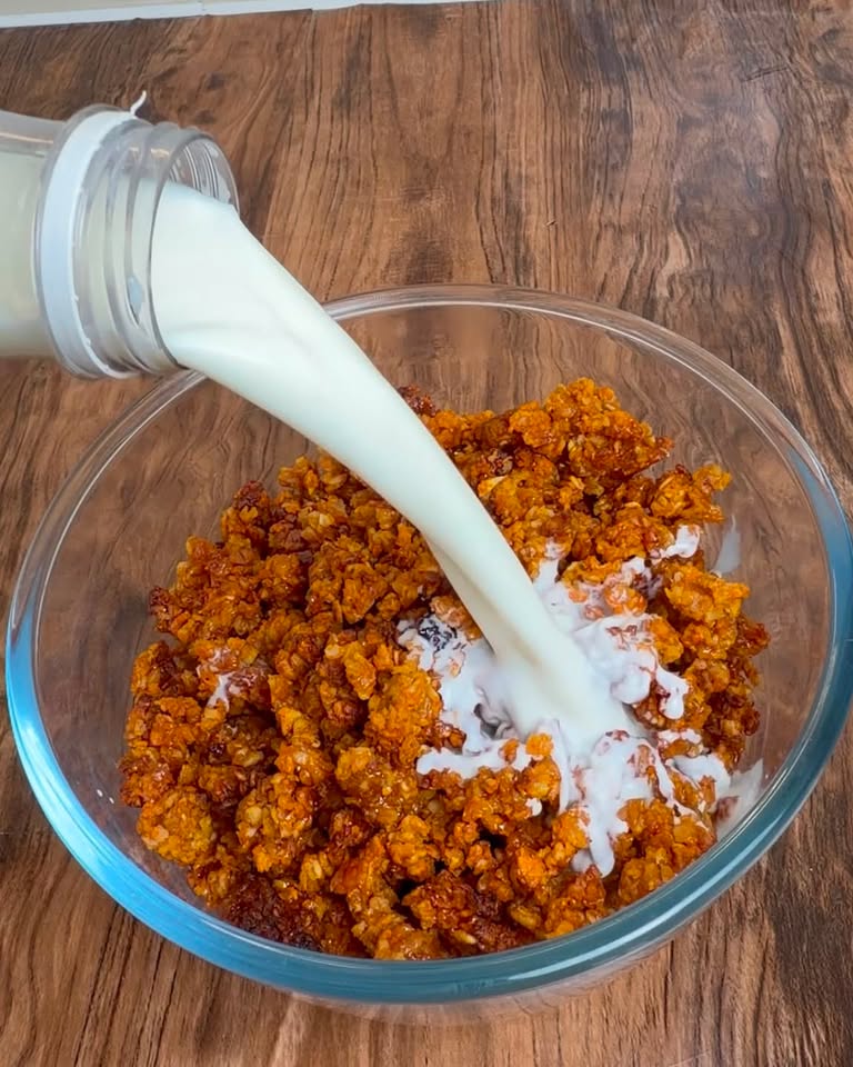 Milk poured over sweet potato granola