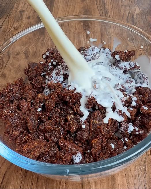 Milk poured over chocolate sweet potato granola
