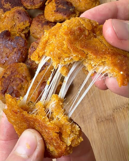Cheese-stuffed sweet potato dough balls with cheese pull