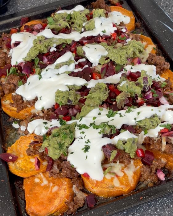 Loaded sweet potato nachos with beef, guac and sour cream