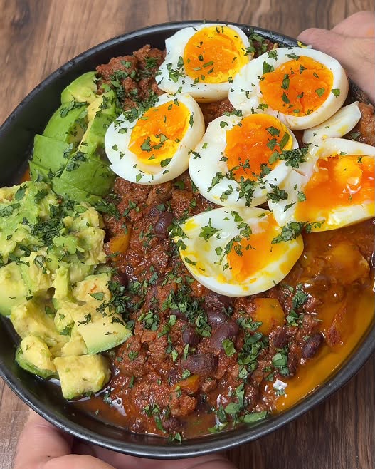 Chilli beef bowl with soft-boiled eggs and avocado